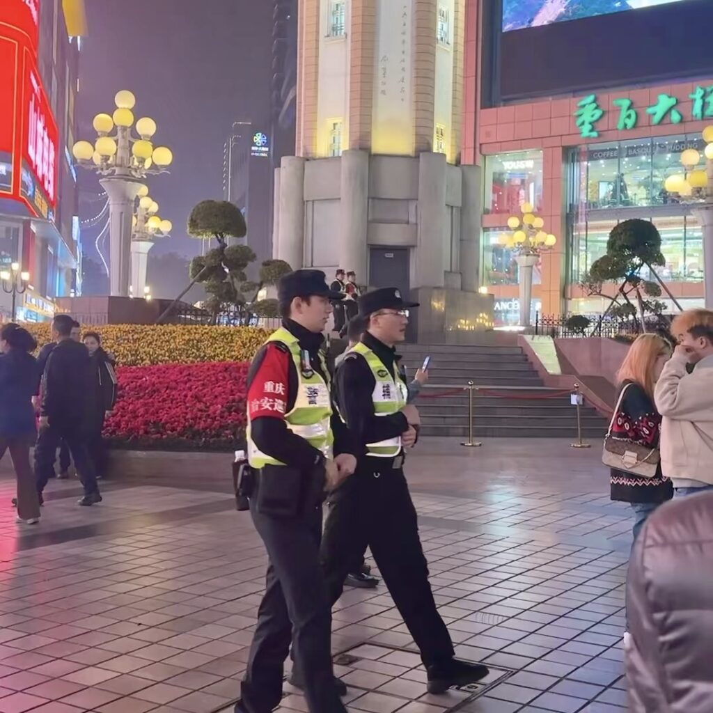 Tourists navigating Jiefangbei Pedestrian Street safely