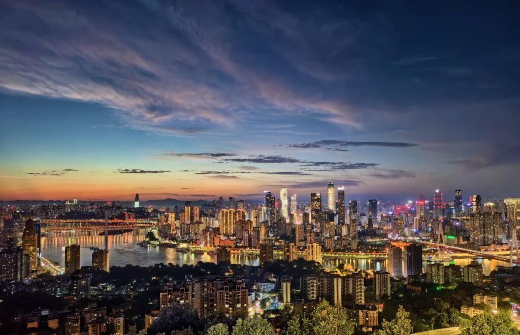 Things to do in Chongqing2 Panoramic sunset view of the Chongqing skyline from the Nanshan One Tree Hill Observation Deck.