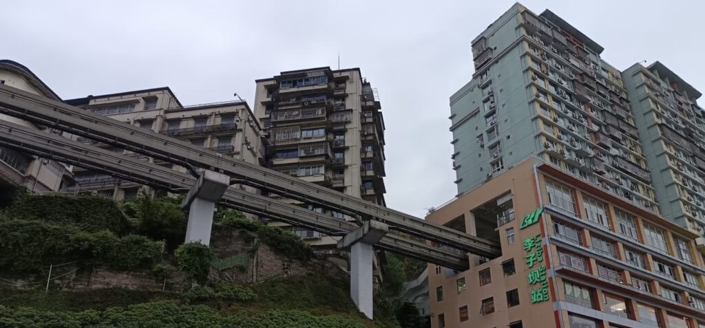 construction phase of Liziba station with the skeletal frame of the building around the tracks